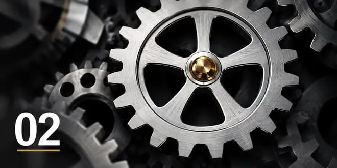 Precision-cut metal gears interlocking, symbolising stronger processes